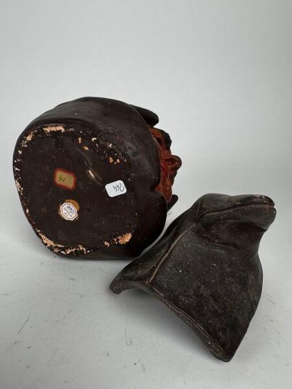 Tobacco jar. A large head of a hooded monk,...