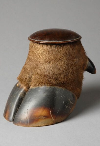 Tobacco jar carved from a buffalo leg; the...