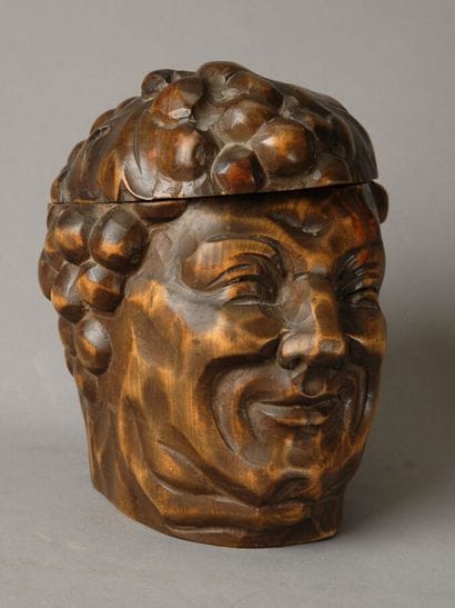 Tobacco jar. This large, cheerful head of...