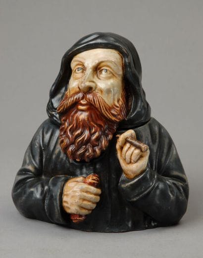 A tobacco jar shaped like the bust of a monk...