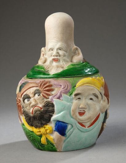 A tobacco jar of Japanese origin, featuring...