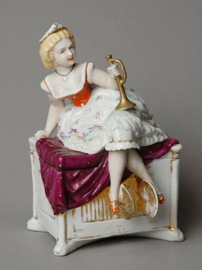 A large tobacco jar, roughly rectangular...