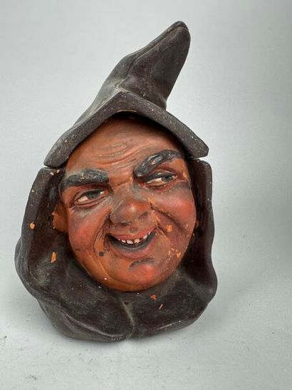 Tobacco jar. A large head of a hooded monk,...