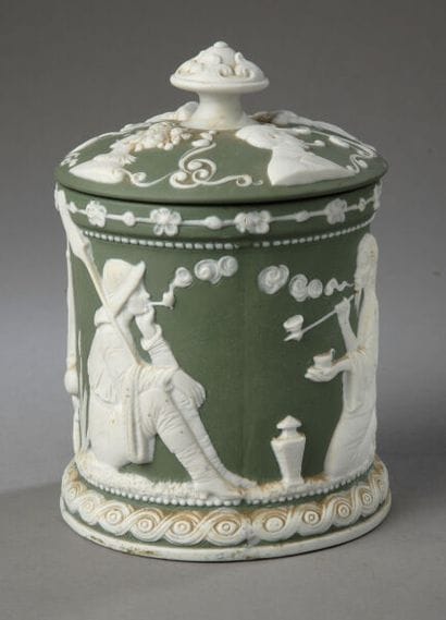 Tobacco jar. On a matte gray-green background,...