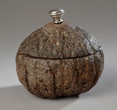 An intriguing tobacco jar carved from a coconut....