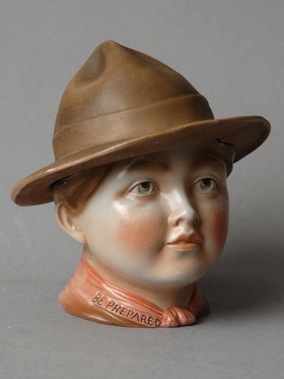 A tobacco jar depicting the head of a Boy...