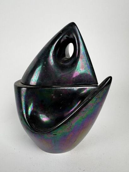 A metallic midnight blue urn, roughly triangular...
