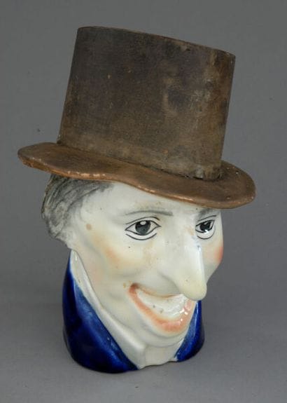 Tobacco jar. A caricature of a man with a...