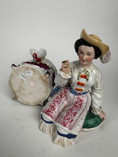 Tobacco jar. A figure of a woman of easy...
