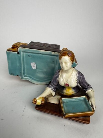 A composite tobacco jar depicting a smiling...