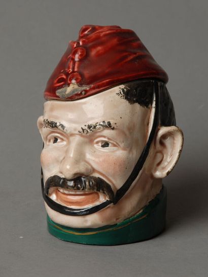 Tobacco jars 
One depicts the head of a mustachioed,...