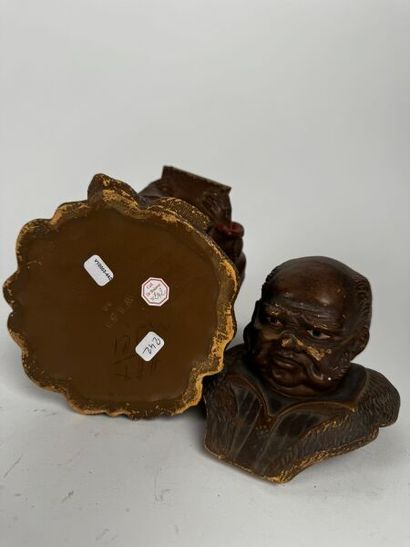 Tobacco Jar
A brown terracotta figure, identical...