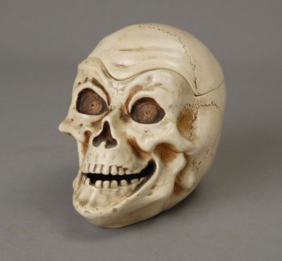 A large tobacco jar made of glossy white...