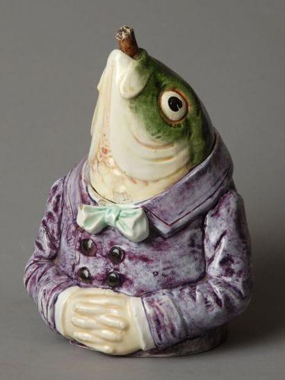 A whimsical tobacco jar depicting the head...