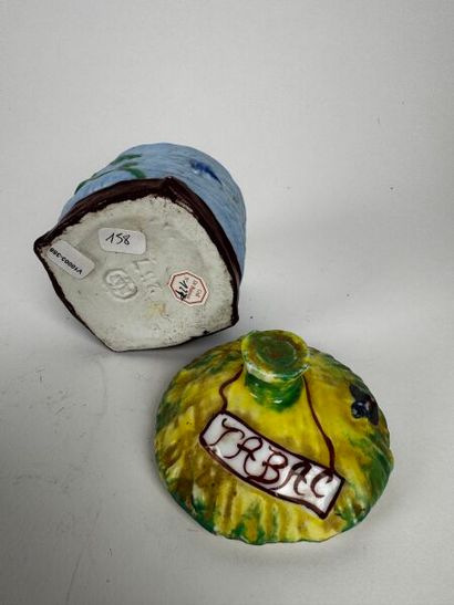 Small, sky-blue, cylindrical tobacco jar...