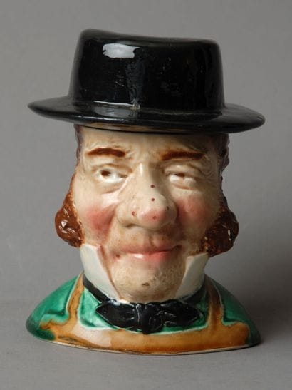 Tobacco jar. The figure is that of a bourgeois...