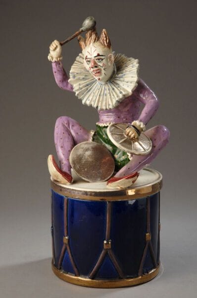 A large composite tobacco jar consisting...