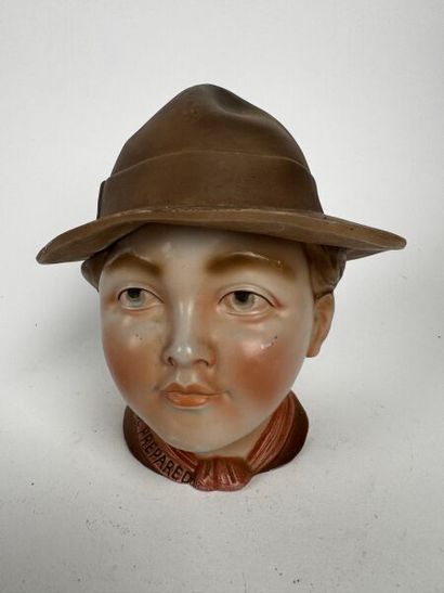 A tobacco jar depicting the head of a Boy...