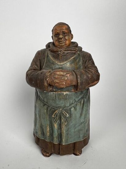 A tall tobacco jar depicting, full-length,...
