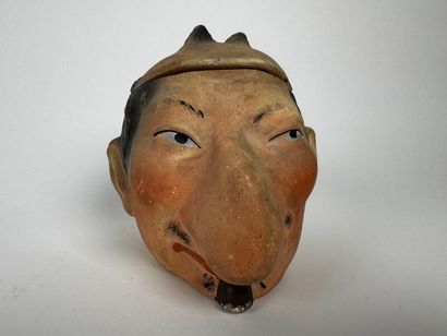 Tobacco Jar
A small caricatured head of a...