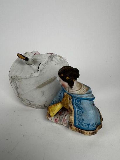 A tobacco jar depicting an elegant Second...