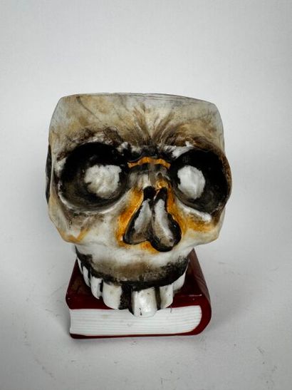 A large tobacco jar made of glossy white...