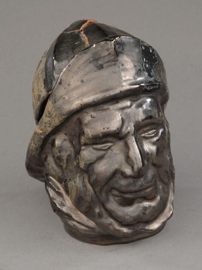 Tobacco jar
Anthracite-gray glazed earthenware...