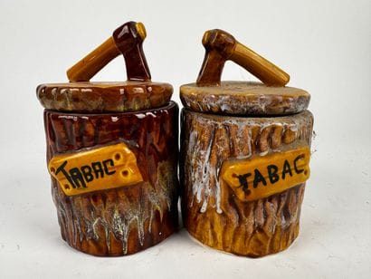 Cylindrical tobacco jars made of reddish-brown...