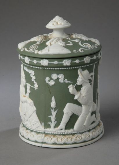 Tobacco jar. On a matte gray-green background,...