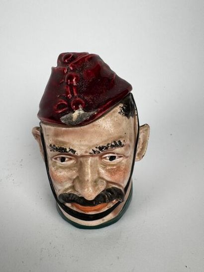 Tobacco jars 
One depicts the head of a mustachioed,...