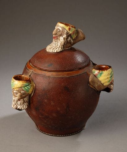 Leather-covered tobacco jar shaped like an...