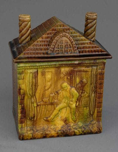 Rectangular tobacco jar depicting a brick...