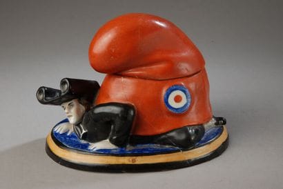 A humorous tobacco jar depicting a priest...