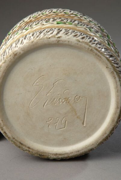 Cylindrical tobacco jar with gray-green and...