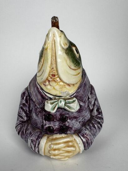 A whimsical tobacco jar depicting the head...