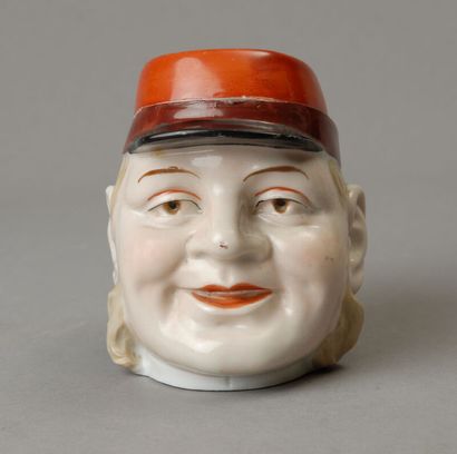 Tobacco jars 
One depicts the head of a mustachioed,...