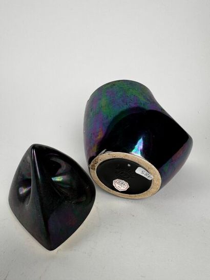 A metallic midnight blue urn, roughly triangular...
