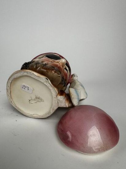 A tobacco jar identical to the previous one,...