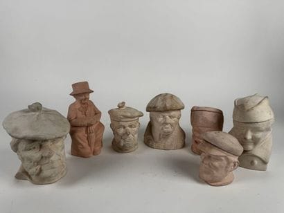 Set of seven bisque-fired terracotta pots...