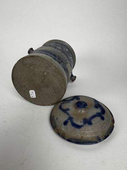 Tall, urn-shaped tobacco jar made of gray...