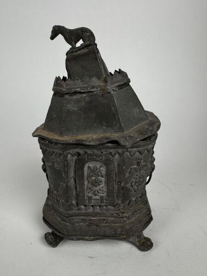 An octagonal pewter tobacco jar, also resting...