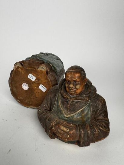 A tall tobacco jar depicting, full-length,...