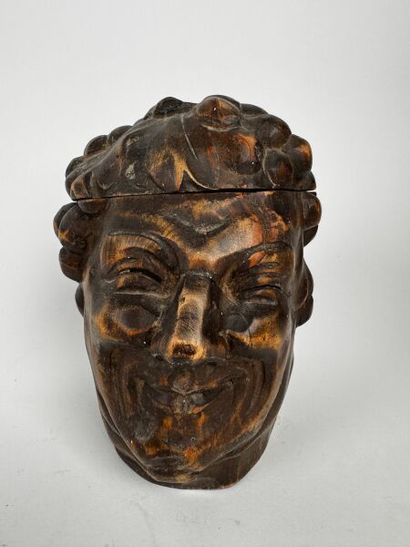 Tobacco jar. This large, cheerful head of...