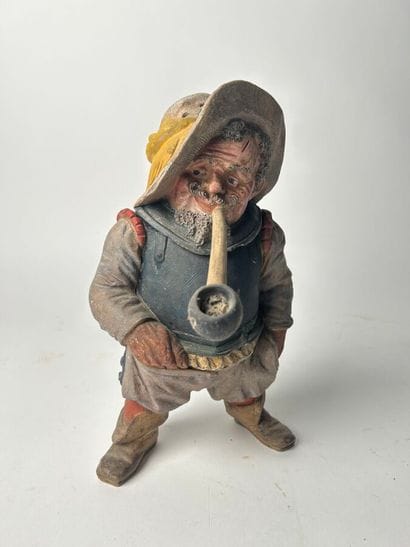 Polychrome terracotta figure of a swordsman....