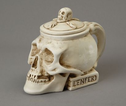 A large tobacco jar made of glossy white...