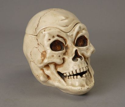 A large tobacco jar made of glossy white...