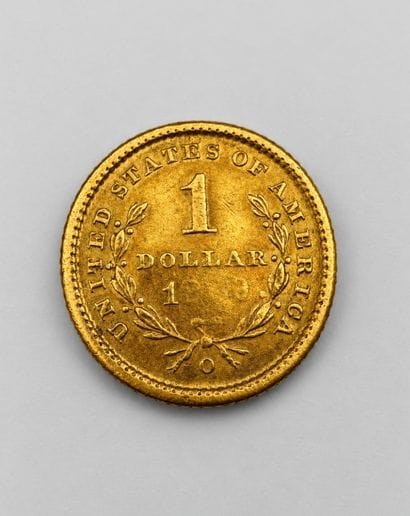 1 $ or, pièce usée, date illisible (18?9)...