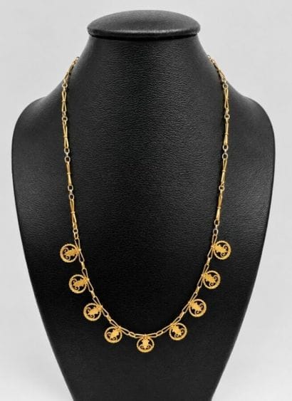 Un collier or 18k 11,1gr marqué au poids