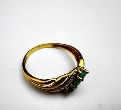 Bague en ors bicolores 18k ornée d'un ligne...