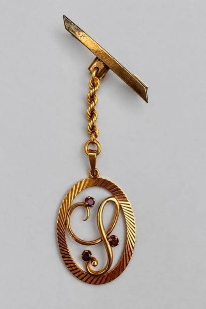 Chaîne et pendentif or orné de 3 pierres...